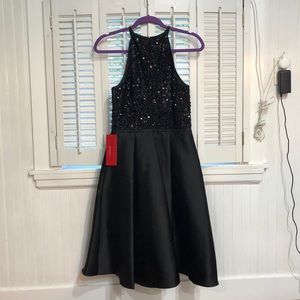 Carmen Mark black cocktail dress.